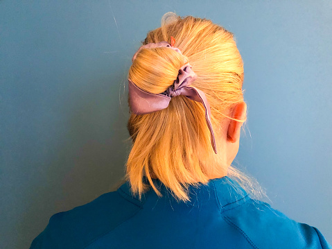 Blond Woman's Hairstyle Rear View Bun Ribbon
