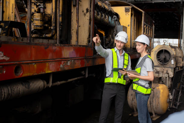 istock Young caucasian engineer man and woman checking train with tablet in station, team engineer inspect system transport, technician examining infrastructure, transportation and industry. 1918656715