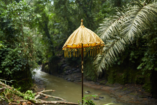 Traditional umbrellas at a jungle temple on the popular tourist island of Bali