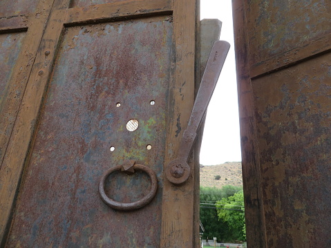 Old Iron Door with Knocker Ring in Eureka, Nevada, Wild West History. High quality photo