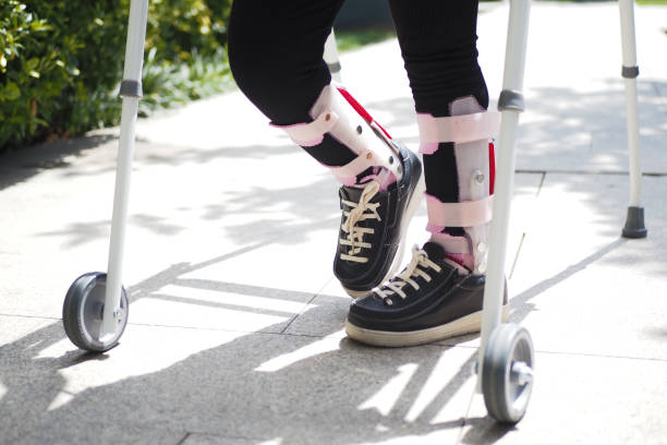 istock child with walking frame and knee orthosis outdoor 1918694614