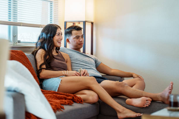 istock Young Pacific Islander couple relaxing at home 1918697201