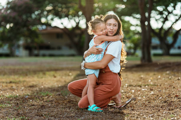 istock Affectionate little girl giving her mom a hug 1918697232