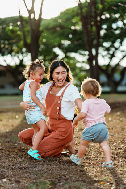 istock Loving mom playing outside with her kids 1918697233