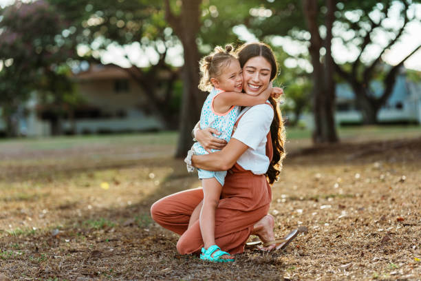 istock Affectionate little girl giving her mom a hug 1918697235