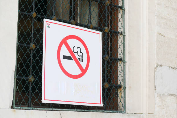 istock No smoke sign on a tree at public park. 1918699940
