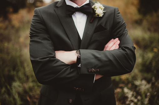 Wedding with groom in suit with boutonniere