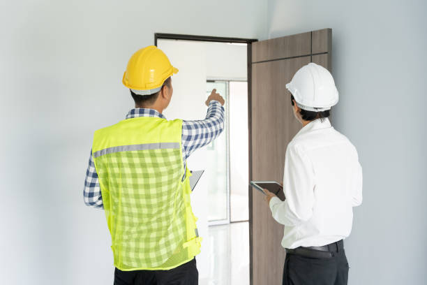 istock inspector engineer and owner project is inspecting construction and quality assurance new house. Engineers or architects or contactor work to build the house before handing it over to the homeowner 1918774238