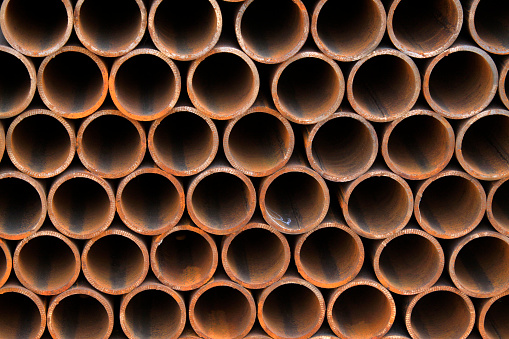 Piles of steel pipe, closeup of photo