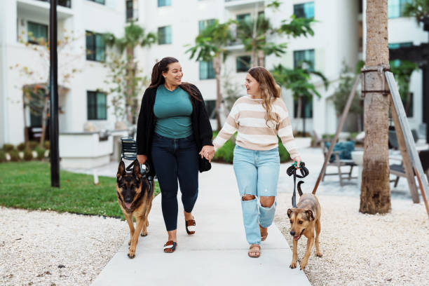 istock Lesbian couple taking their dogs for a walk 1918837995