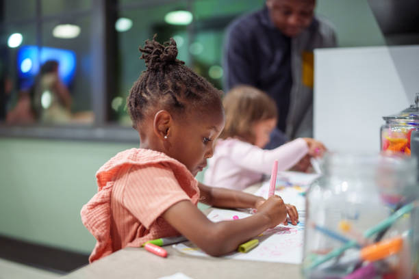 Preschool age girl coloring