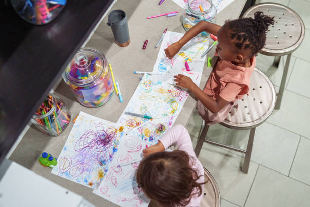 istock Preschool age girls coloring 1918838616