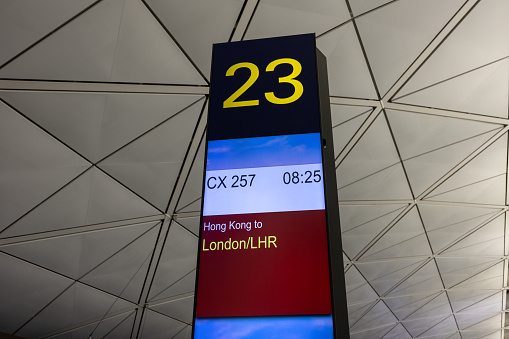 Hong Kong - December 19, 2023 : Departure gate for flight operated by Cathay Pacific to London Heathrow Airport at Hong Kong International Airport.