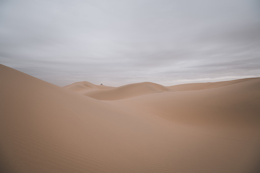 Desert scene in Wuhai . Inner Mongolia. China. Tall dunes with copy space for text. Dramatic sky