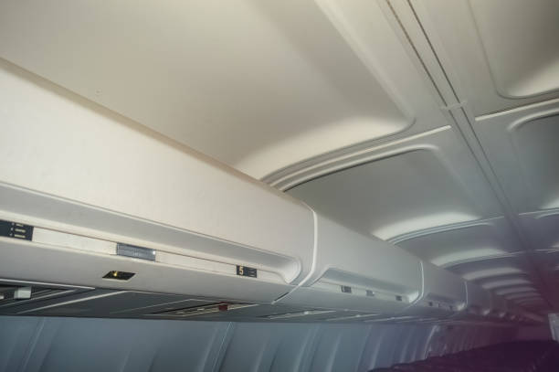 istock Overhead bin in the aircraft interior for storing passenger luggage 1918865608