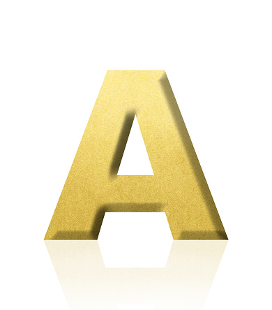 Close-up of three-dimensional gold alphabet letter A on white background.