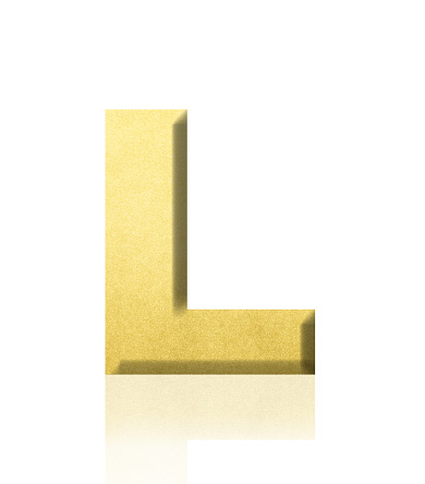 Close-up of three-dimensional gold alphabet letter L on white background.