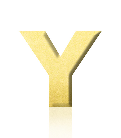 Close-up of three-dimensional gold alphabet letter Y on white background.