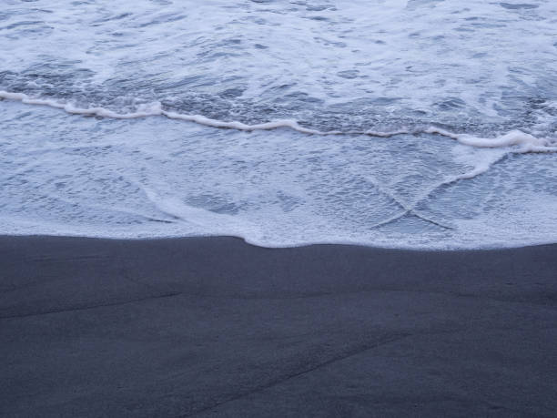 istock beach with black volcanic sand on  Tenerife 1918881770