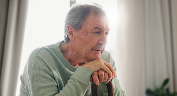 istock Old man, thinking and walking stick, person with disability and remember with reflection at home. Senior care, cane to help with balance and support, Parkinson or arthritis with nostalgia and memory 1918887588