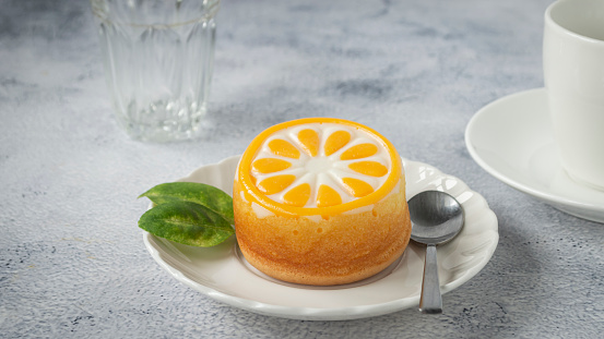 Freshly baked orange cake Sweet and delicious with hot black coffee. on a white background