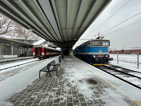 Ostrava, Czech Republic - January 07, 2024: Two trains on a train platform. Ostrava main railway station.