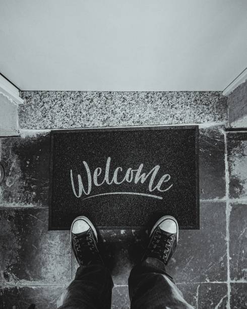 istock Overhead view of person standing on a welcome mat 1918967157