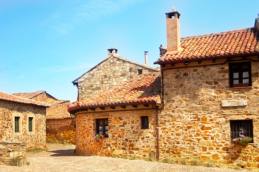 Traditional rural street , stone houses . Village street in  Castrillo de los Polvazares, León, Castilla y León, Spain.