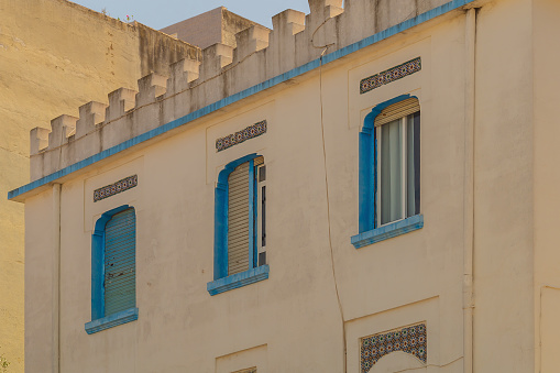 Three windows of varying degrees of shade, fully shuttered, semi-closed, fully open. Seasonal measures to protect home from extremely low or high temperatures.