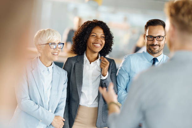 istock Happy business colleagues talking in a casual office. 1918986185