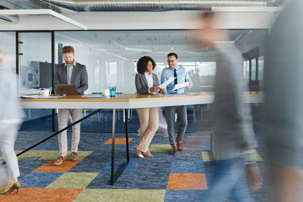 istock Multi-tasking business people among colleagues in blurred motion. 1918995920