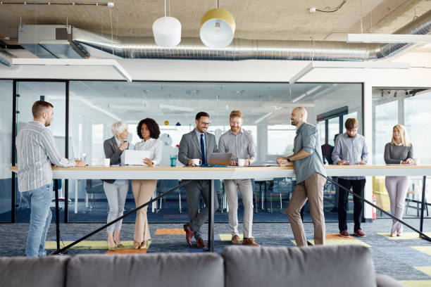 istock Multi-tasking business people working in a modern office. 1918996466