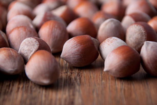 Hazelnuts  on a wooden background of old wood stock photo