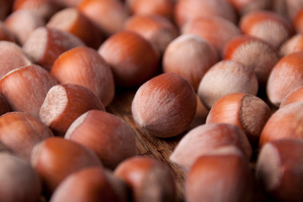 Hazelnuts  on a wooden background of old wood stock photo