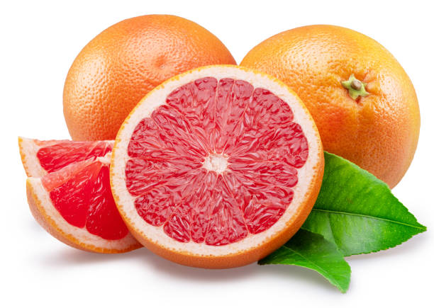 istock Red grapefruits and grapefruit slices on white background. File contains clipping path. 1919049248