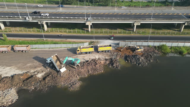 Dump truck and crawler are working at construction site