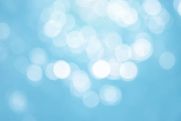 Abstract blurred blue background of bokeh circle glitter.