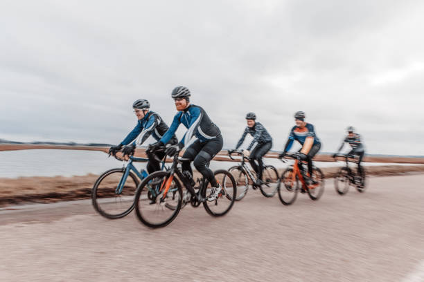 Six friends cycling for exercise in the Netherlands in the winter