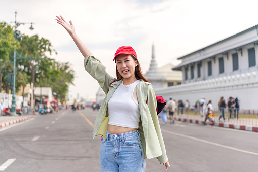 Asian Woman Traveler Discovering Vintage Buildings and Street Life in Downtown Bangkok