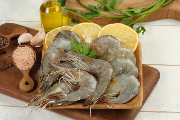 istock raw shrimps in a plate with ingredient on white background 1919086235