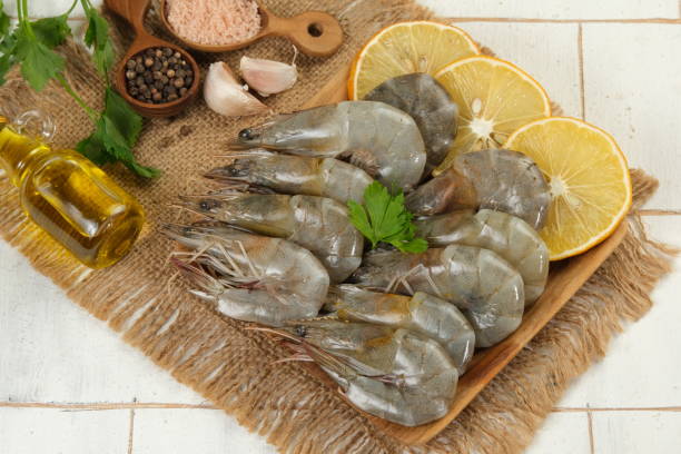 istock raw shrimps in a plate with ingredient on white background 1919086748