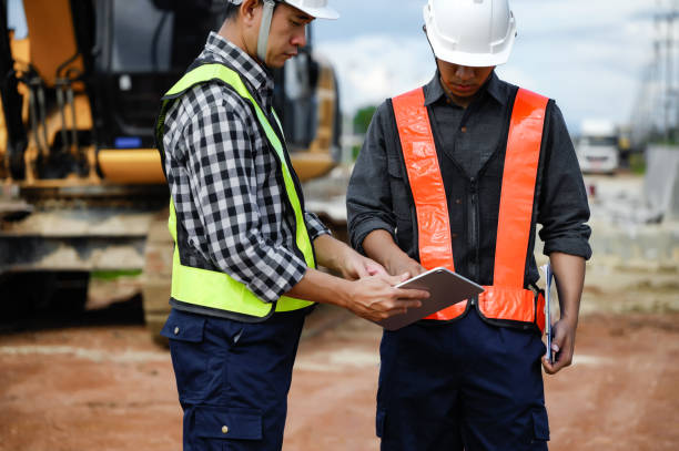 istock Highway Engineer Consultant and Young engineer planning work together with a technology tablet at the road construction site. Management inspects construction projects in workflow and business. 1919089487
