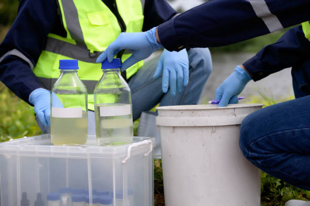 istock Environmental Engineers Team Take Water Samples at Natural Water Sources. Water that smells bad Near Farmland, Fish Ponds May Be Contaminated by Toxic Suspicious Pollution Sites. 1919120062