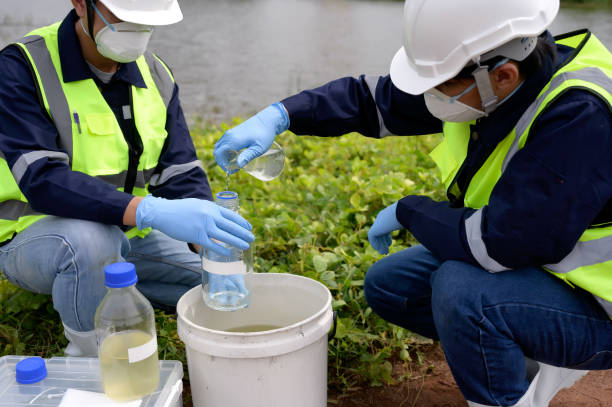 istock Environmental Engineers Team Take Water Samples at Natural Water Sources. Water that smells bad Near Farmland, Fish Ponds May Be Contaminated by Toxic Suspicious Pollution Sites. 1919120063