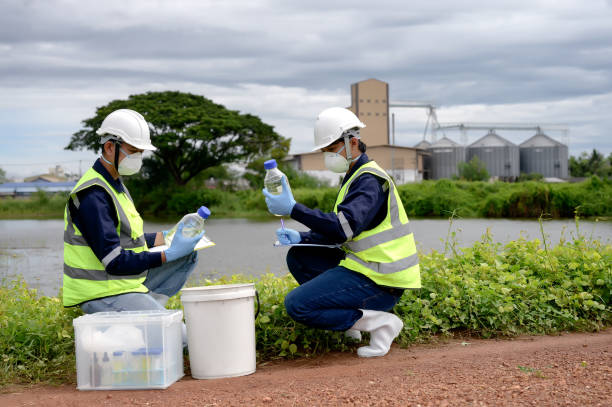 istock Environmental Engineers Team Take Water Samples at Natural Water Sources. Water that smells bad Near Farmland, Fish Ponds May Be Contaminated by Toxic Suspicious Pollution Sites. 1919120071