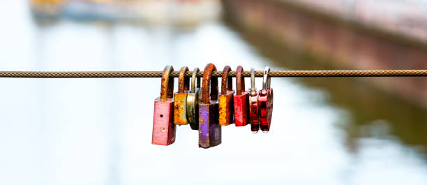 istock Love locks on a wire rope in a row. Objects in close-up 1919122729