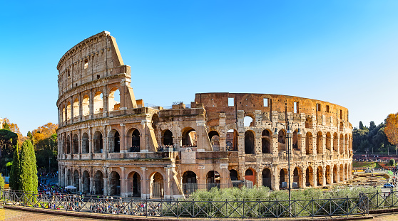 Colosseum (Coliseum) is one of main travel attraction of Rome, Italy. Panorama of Ancient Roman ruins, landscape of old Rome city.