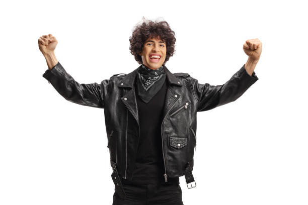 istock Excited young man in a leather jacket and black scarf gesturing happiness 1919194126