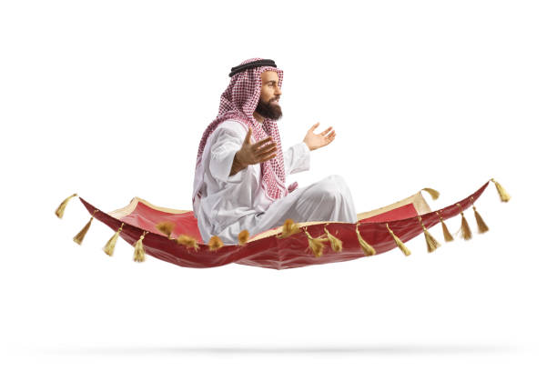 istock Saudi arab man sitting on a magic carpet and flying 1919206998