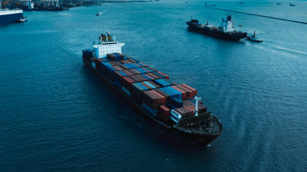 istock logistic cargo container ship sailing in sea to import export goods and distributing products to dealer and consumers shipping port background, cinematic blue tone process, 1919215095